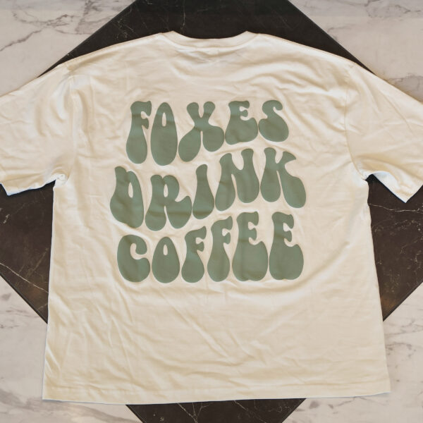 MERCH-tshirt-tan_back Neutral Color with Green Foxes Drink Coffee T-shirt